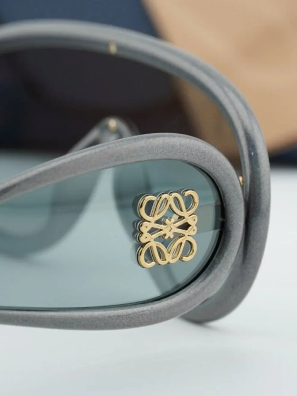 Loewe Gray Curved Frame Sunglasses with Gold Anagram Detail